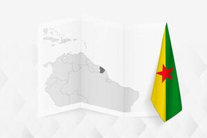 A grayscale map of French Guiana with a hanging French Guianese flag on one side. Map for many types of news. vector