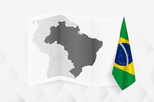 A grayscale map of Brazil with a hanging Brazilian flag on one side. Map for many types of news. vector