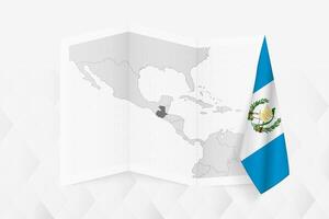 A grayscale map of Guatemala with a hanging Guatemalan flag on one side. Map for many types of news. vector