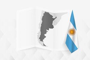 A grayscale map of Argentina with a hanging Argentinian flag on one side. Map for many types of news. vector