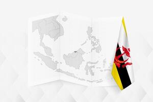 A grayscale map of Brunei with a hanging Bruneian flag on one side. Map for many types of news. vector