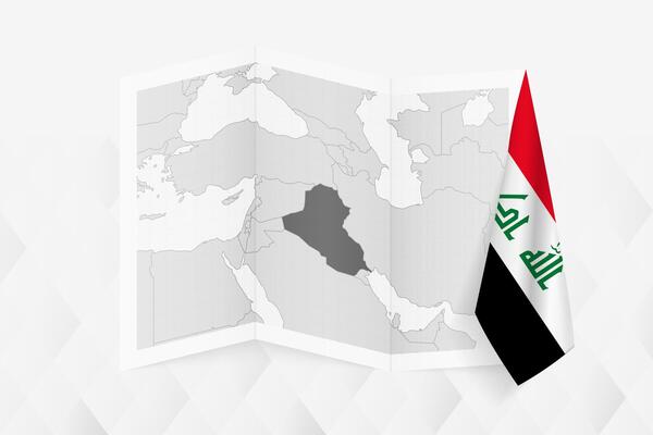 A grayscale map of Iraq with a hanging Iraqi flag on one side. Map for many types of news.