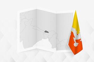 A grayscale map of Bhutan with a hanging Bhutanese flag on one side. Map for many types of news. vector
