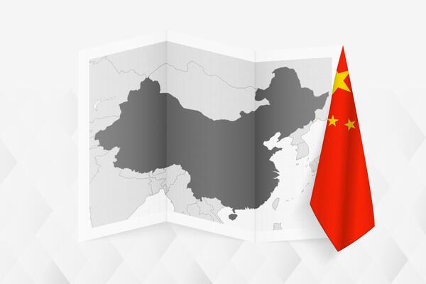 A grayscale map of China with a hanging Chinese flag on one side. Map for many types of news.