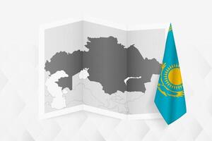 A grayscale map of Kazakhstan with a hanging Kazakhstani flag on one side. Map for many types of news. vector