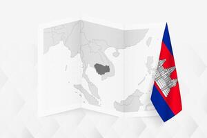A grayscale map of Cambodia with a hanging Cambodian flag on one side. Map for many types of news. vector