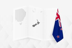 A grayscale map of New Zealand with a hanging New Zealand flag on one side. Map for many types of news. vector