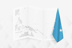 A grayscale map of Micronesia with a hanging Micronesian flag on one side. Map for many types of news. vector