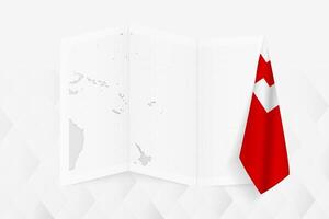 A grayscale map of Tonga with a hanging Tongan flag on one side. Map for many types of news. vector