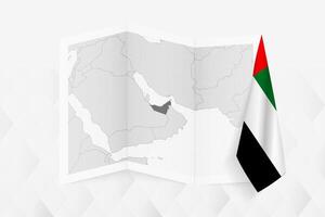 A grayscale map of United Arab Emirates with a hanging Emirati flag on one side. Map for many types of news. vector