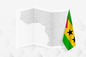 A grayscale map of Sao Tome and Principe with a hanging Sao Tome and Principe flag on one side. Map for many types of news. vector