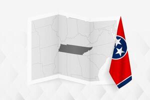 A grayscale map of Tennessee with a hanging Tennessee flag on one side. Map for many types of news. vector
