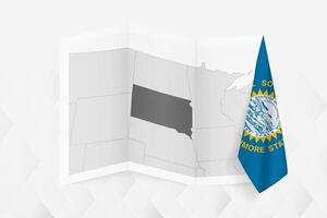 A grayscale map of South Dakota with a hanging South Dakota flag on one side. Map for many types of news. vector