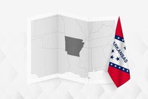 A grayscale map of Arkansas with a hanging Arkansas flag on one side. Map for many types of news. vector
