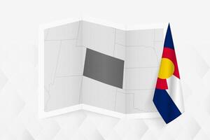 A grayscale map of Colorado with a hanging Colorado flag on one side. Map for many types of news. vector
