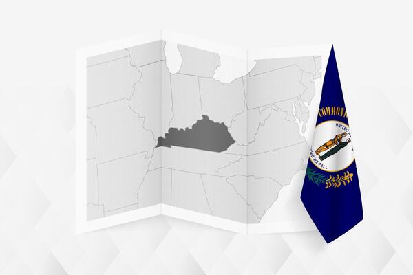 A grayscale map of Kentucky with a hanging Kentucky flag on one side. Map for many types of news.