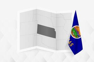 A grayscale map of Kansas with a hanging Kansas flag on one side. Map for many types of news. vector