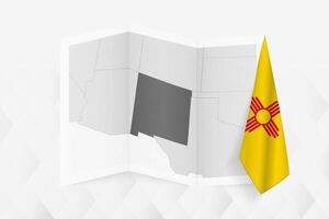 A grayscale map of New Mexico with a hanging New Mexico flag on one side. Map for many types of news. vector