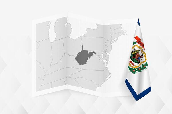 A grayscale map of West Virginia with a hanging West Virginia flag on one side. Map for many types of news.