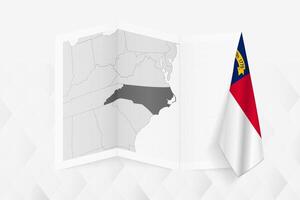 A grayscale map of North Carolina with a hanging North Carolina flag on one side. Map for many types of news. vector