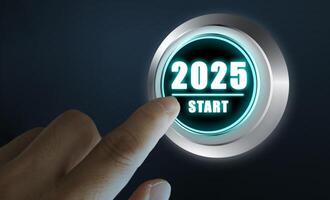 Finger about to press a car ignition button with the text 2025 start. Year two thousand and twenty five concept. photo
