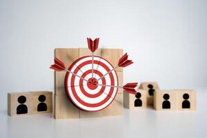 Red dartboard and black arrow connection linkage with human icon for customer focus target group photo