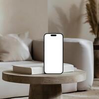 Black titanium smartphone mockup template with blank screen on marble table photo