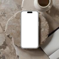 White smartphone mockup template with blank screen on marble surface photo