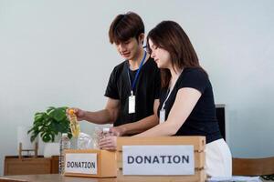 Community donation event local center volunteer activity indoor space engaging interaction supporting social causes photo