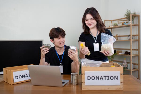 Community donation drive local center volunteer activity indoor setting engaging perspective philanthropic concept