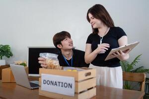 Donation drive event with volunteers community center image of fundraiser activity indoor setting engaging atmosphere generosity concept photo