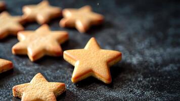 Minimalist artistic presentation of Christmas cookies on a matte black surface with elegant lighting emphasizing their form and texture. Christmas cookies video