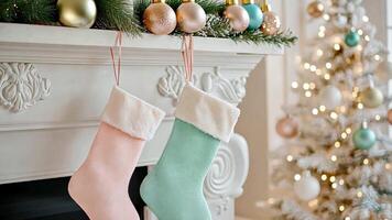 Lighthearted pastel stockings in pink and mint, surrounded by soft white decor and twinkling lights, creating a playful Christmas atmosphere. Christmas stockings, New Year video