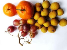 A bunch of fruit on a white surface photo