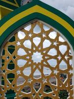 A golden arch with a pattern on it photo