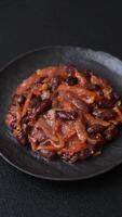 Vegan or vegetarian stew with red beans, onions and carrots or lobio with salt, spices and herbs video