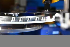 High-quality control in manufacturing optical sorting machine for fasteners nuts in product line photo