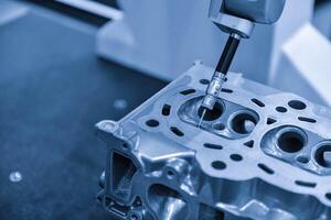 Automatic coordinate measurement machine CMM for inspection high precision part during working photo