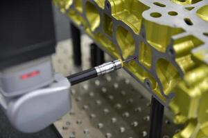 Automatic coordinate measurement machine CMM for inspection high precision part during working photo