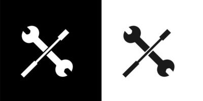 two crossed wrenches on a black and white background vector