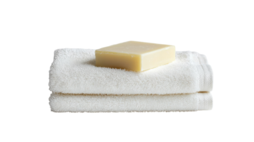 A stack of towels with a soap bar on top png