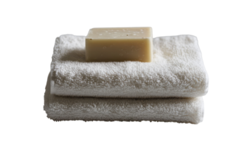 A stack of towels with a soap bar on top png