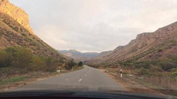 Stock 4K Point of View Hyperlapse Time-lapse of car driving pass canyon open mountain area on Both Sides High Speed On The Open Road. FAst Hyperlapse Road Trip Travel Concept Sort of Dashcam POV video