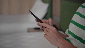 Close-up. An unrecognizable woman uses a smartphone. Hands and phone in the frame, internet technology and wi-fi. video