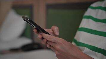 Close-up. An unrecognizable woman uses a smartphone. Hands and phone in the frame, internet technology and wi-fi. video