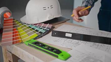 Person with hard hat and level for engineering event video