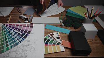 Working in a design studio. Interior designers are working with various palettes, textures, and material samples to select combinations for their project. video