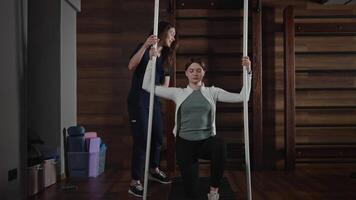Medical sports rehabilitation after injury and surgery. A medical trainer works with a patient under a rehabilitation and recovery program. video