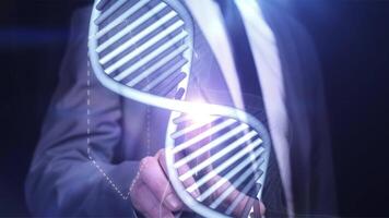 A man works on a virtual panel with the DNA structure. video