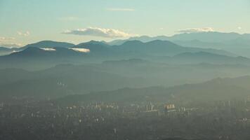 A view of the mountains from the top of a mountain video